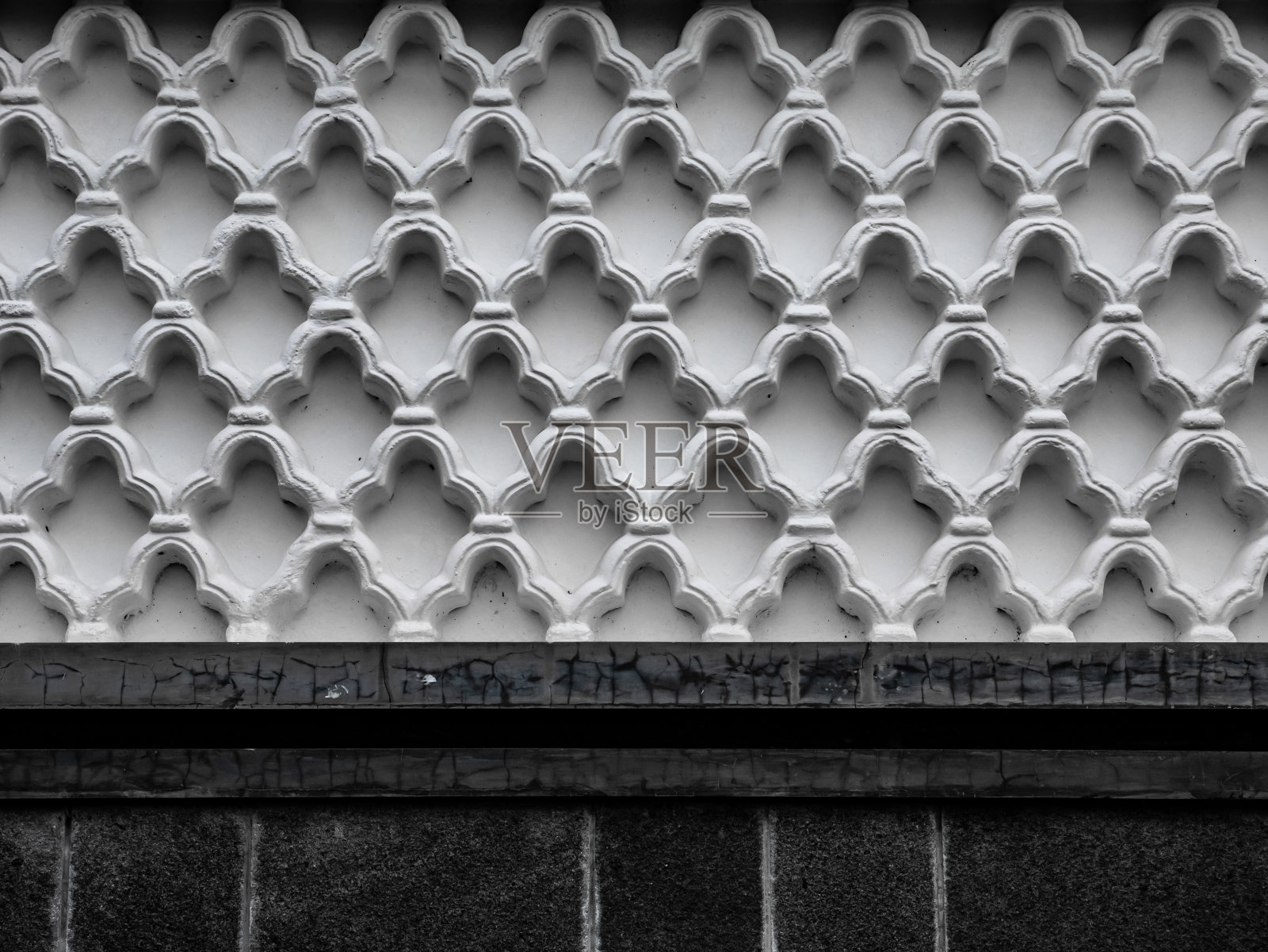 房子的墙壁是白色的，有独特的图案照片摄影图片