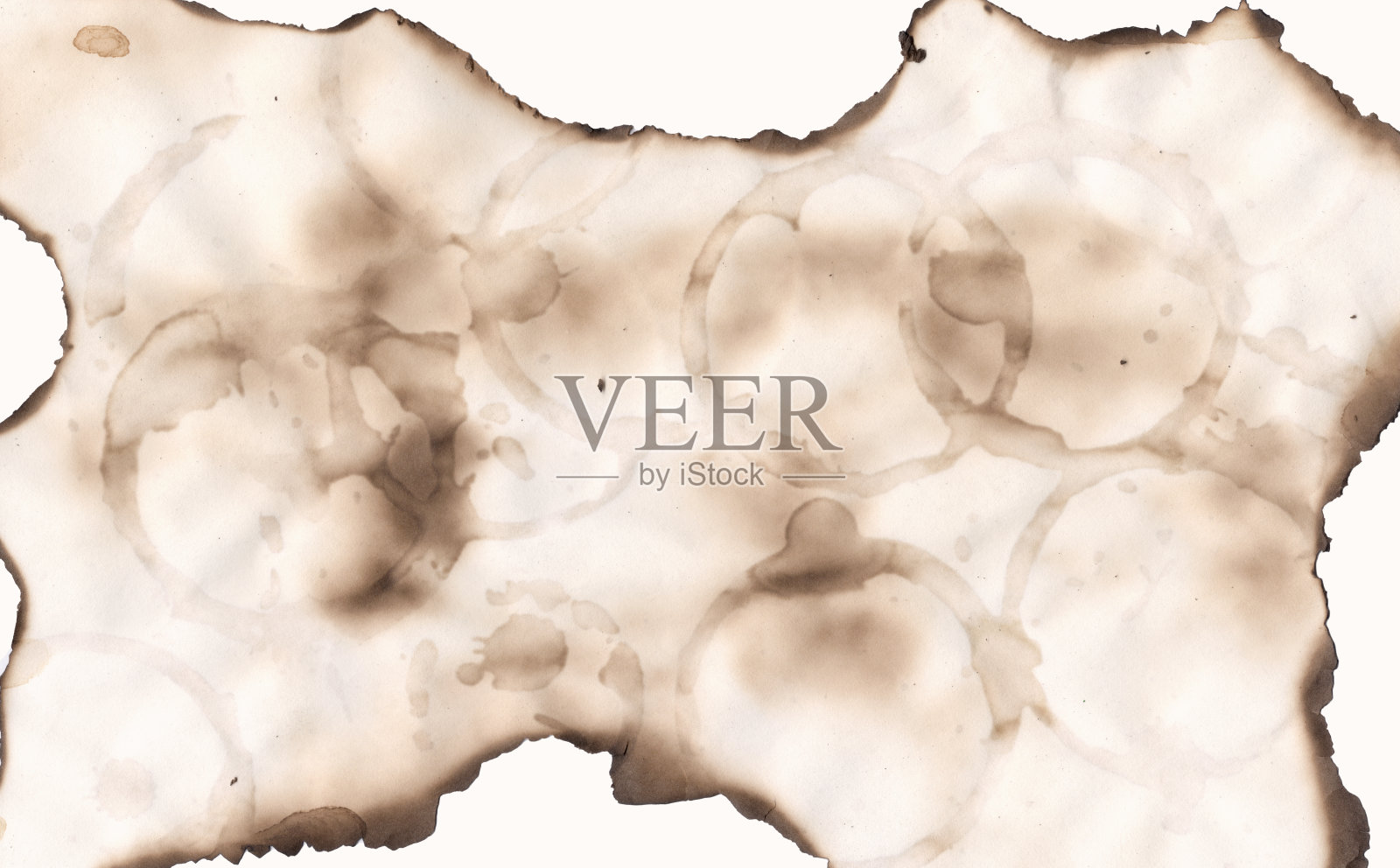 摘要烧纸背景。复古风格的parchament效果。撕边框架。咖啡圈马克杯邮票照片摄影图片