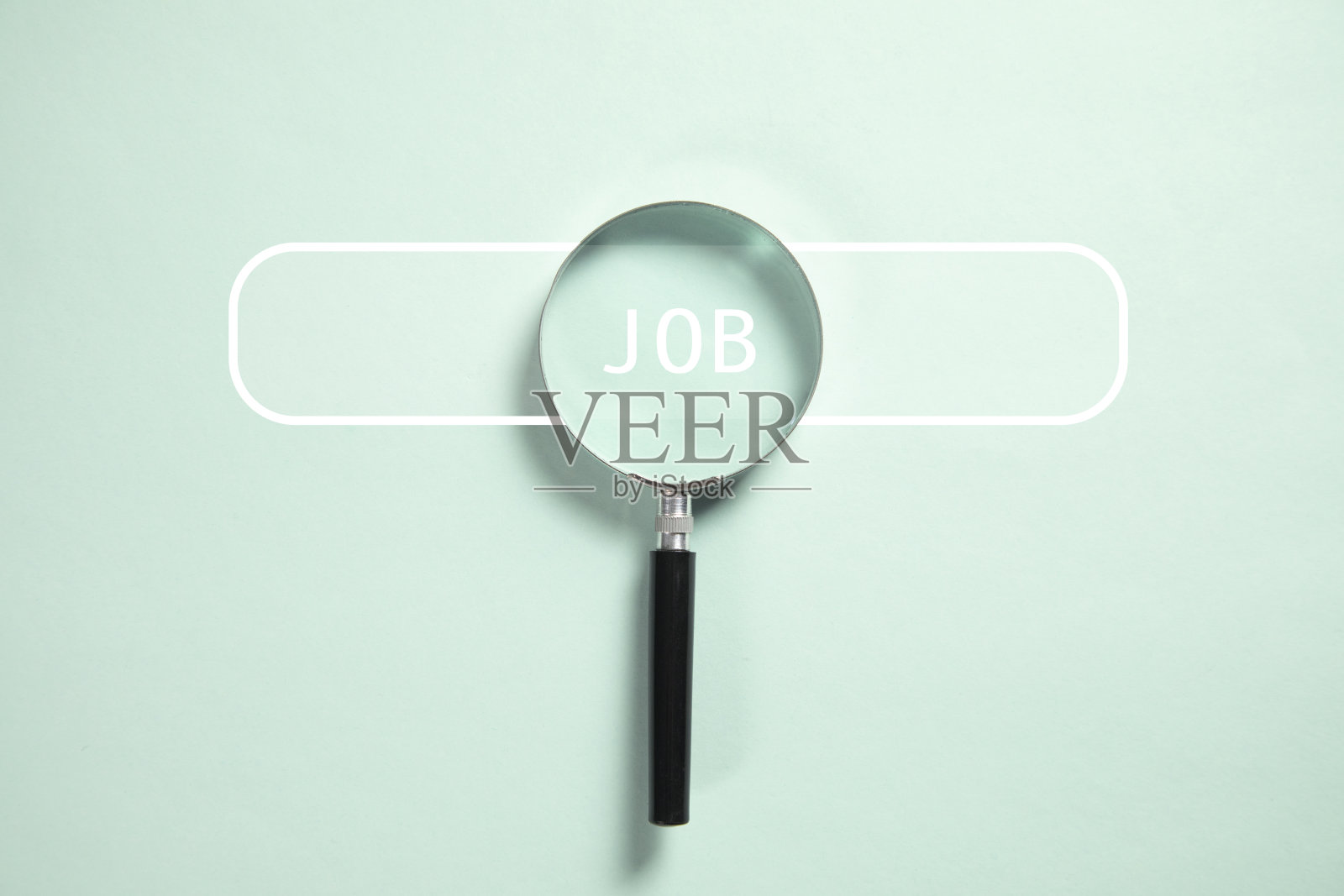 乔布斯用放大镜发短信照片摄影图片