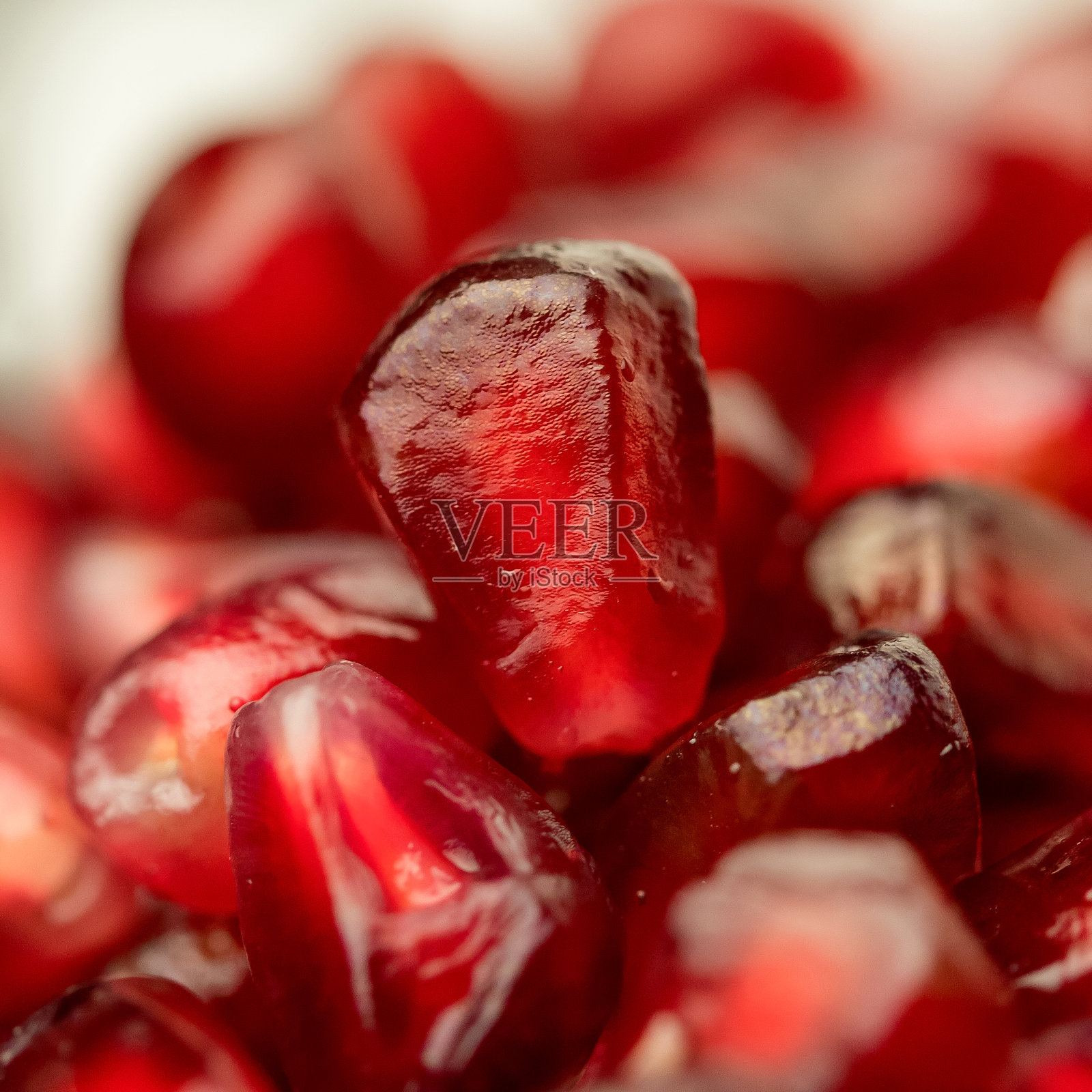 石榴成熟的背景微距照片。照片摄影图片