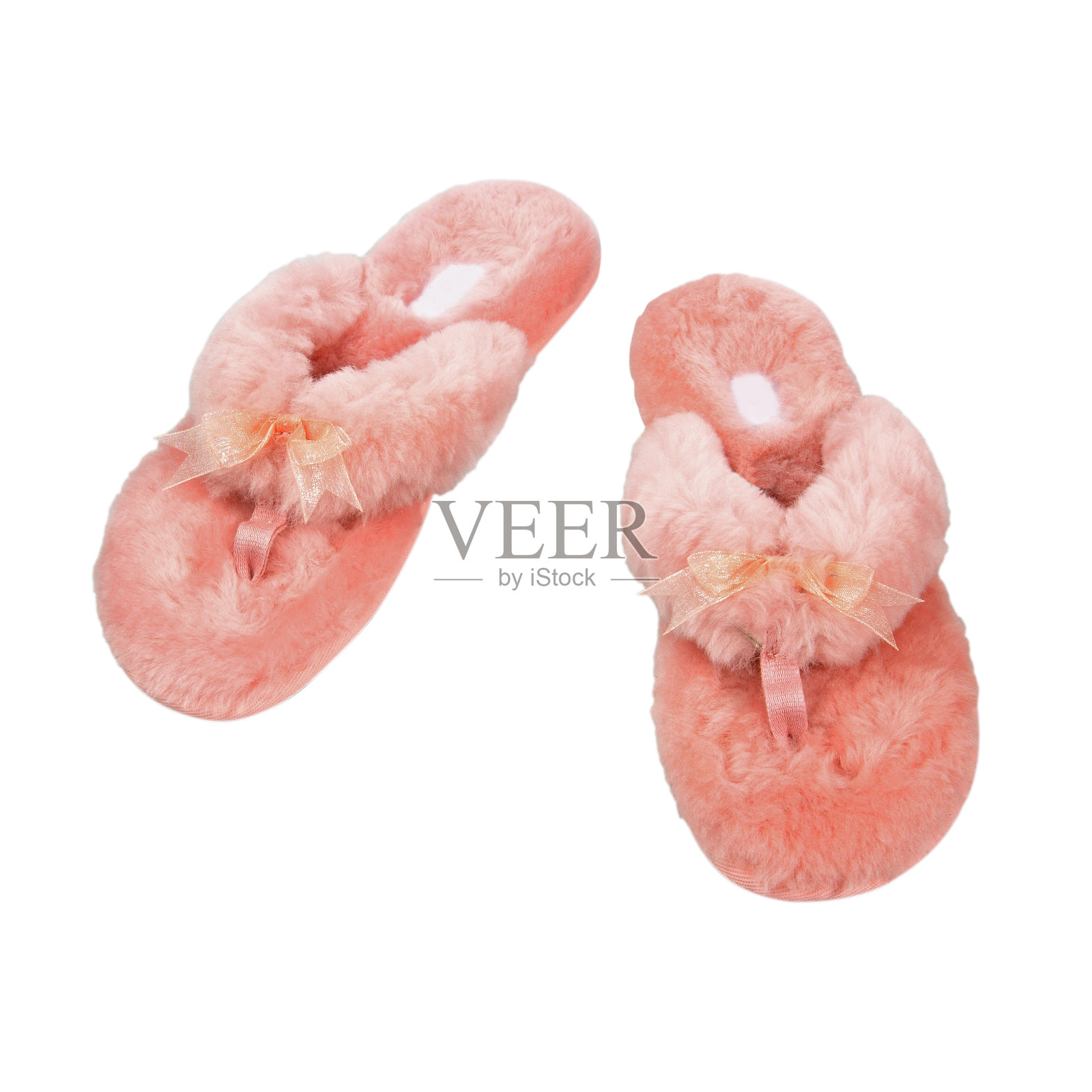 女性毛茸茸的粉红色拖鞋孤立在白色照片摄影图片