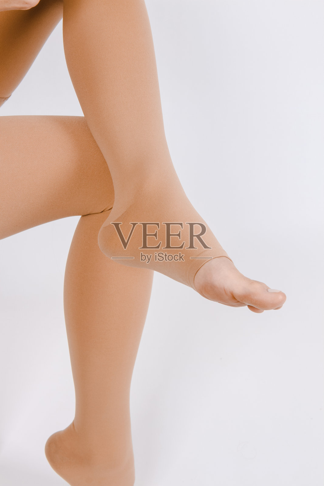 压缩袜子。用于静脉曲张和静脉治疗的医用压缩丝袜和紧身衣。男士和女士的袜子。临床压缩织。孕妇舒适的孕妇紧身衣照片摄影图片