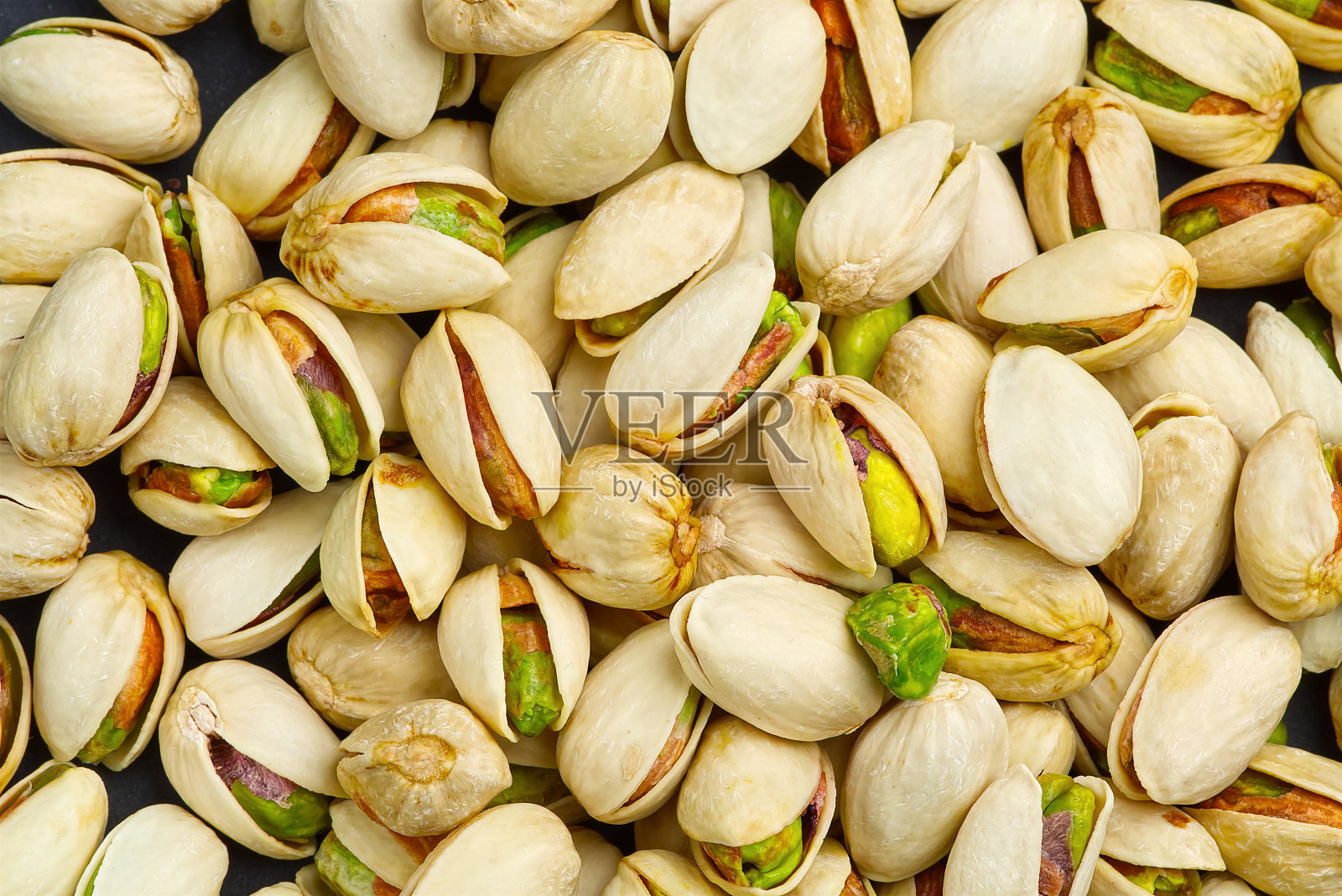 开心果纹理和背景。美味的开心果作背景，复制空间照片摄影图片