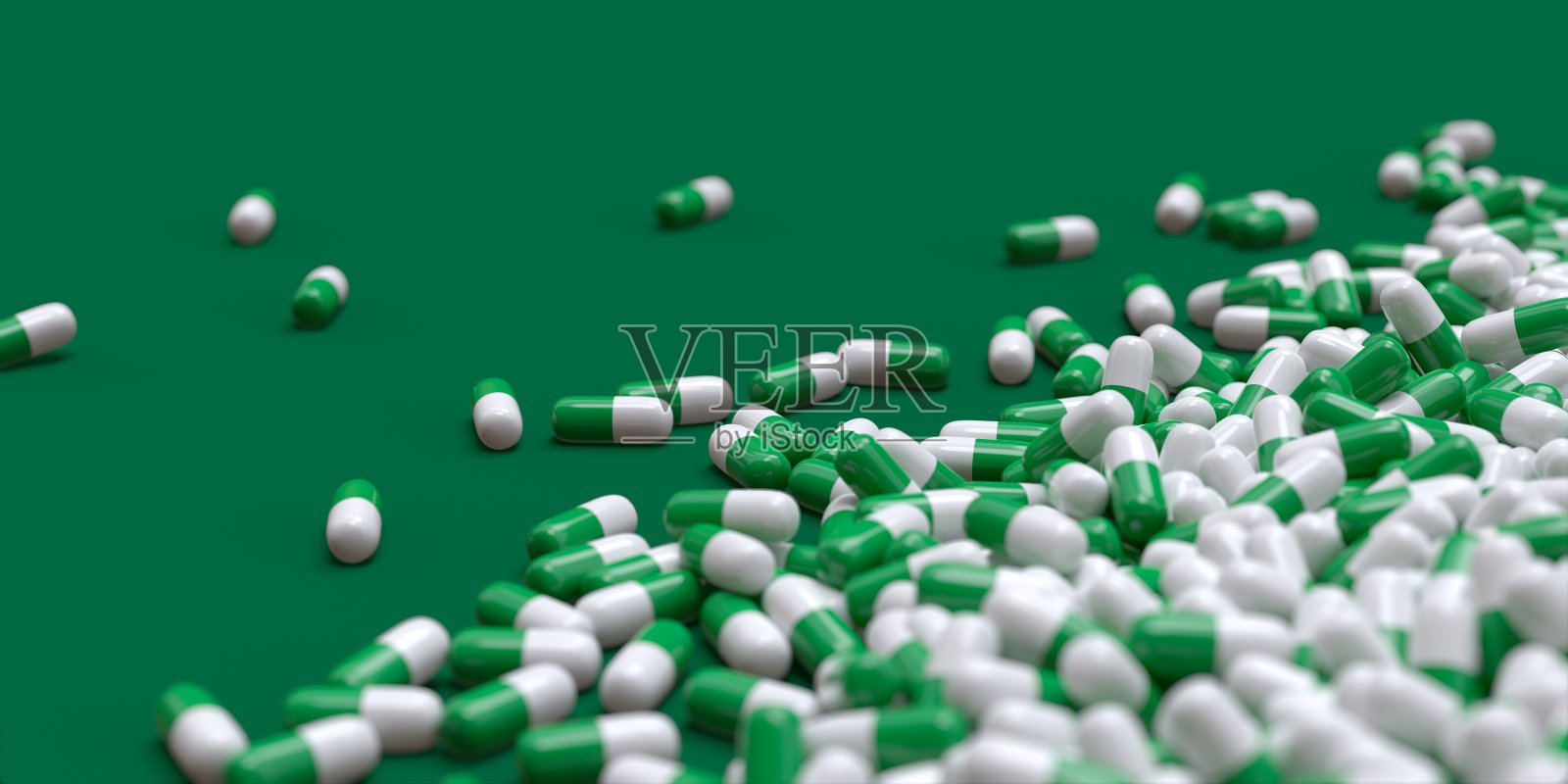 绿色和白色的药物胶囊3D电脑生成孤立在绿色背景上照片摄影图片