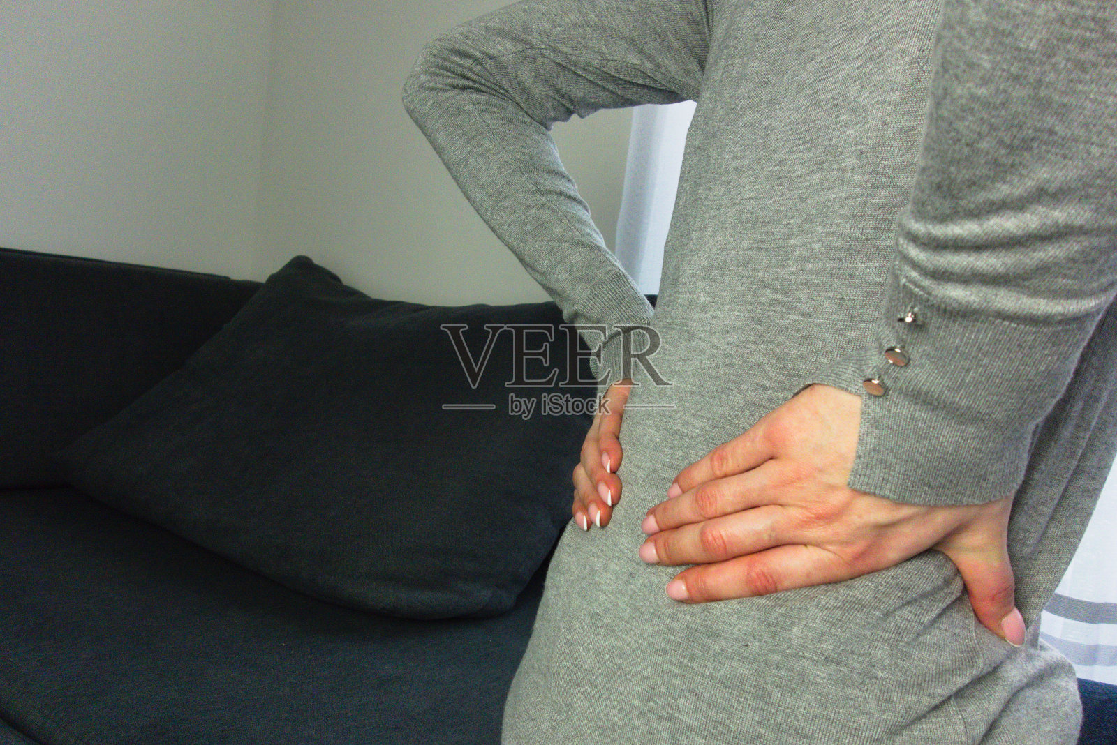 背部疼痛的女人照片摄影图片