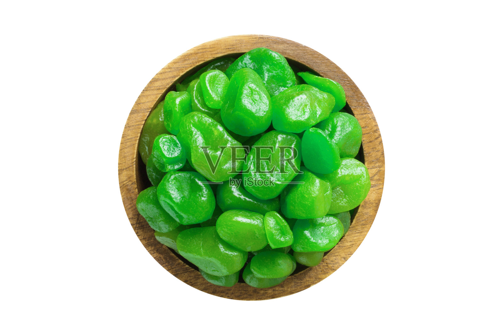 蜜饯，金桔干，糖，柠檬味木碗，白色底色。素食，俯视图。照片摄影图片