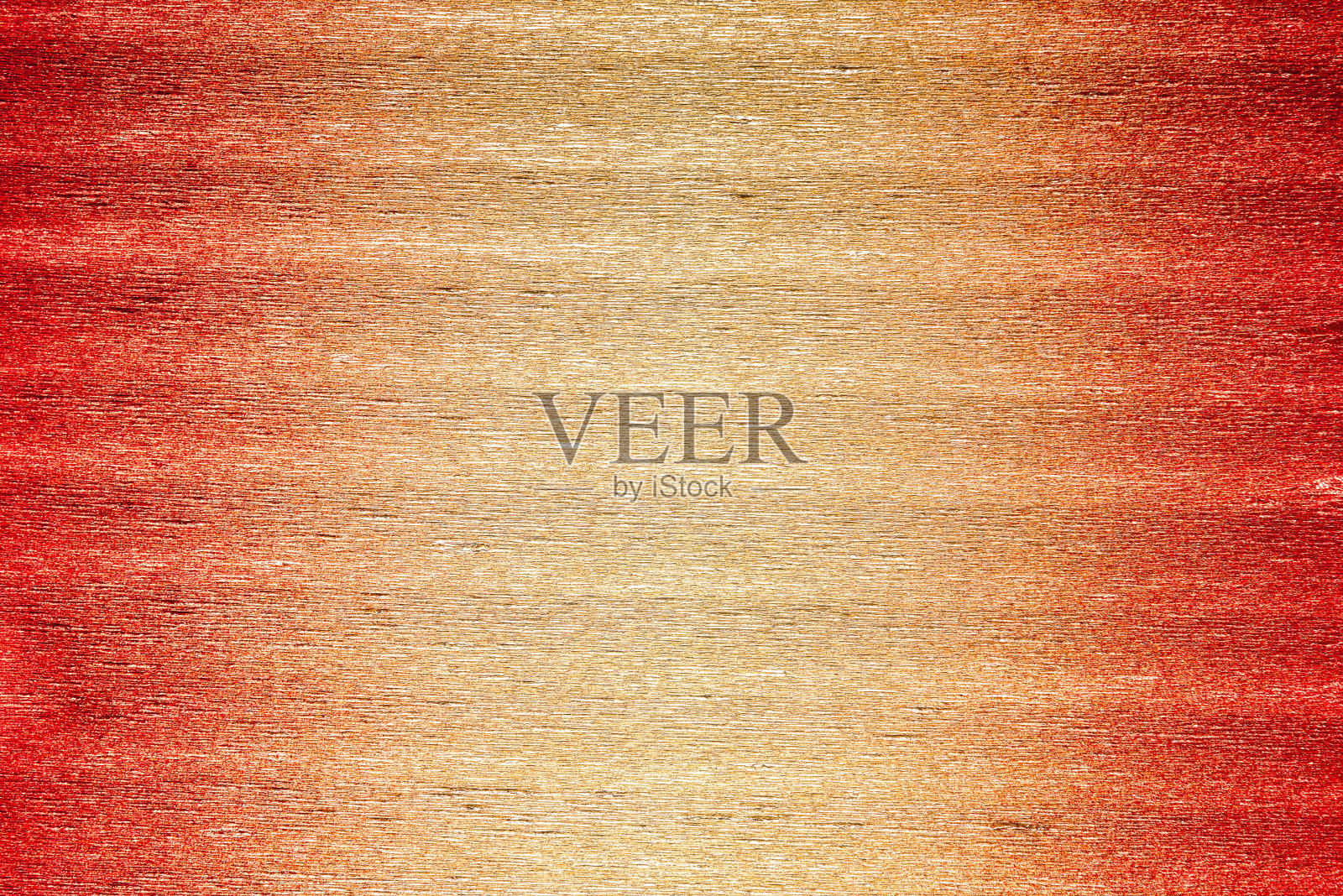 金属绉纸的纹理在红色、橙色和金色的色彩梯度照片摄影图片