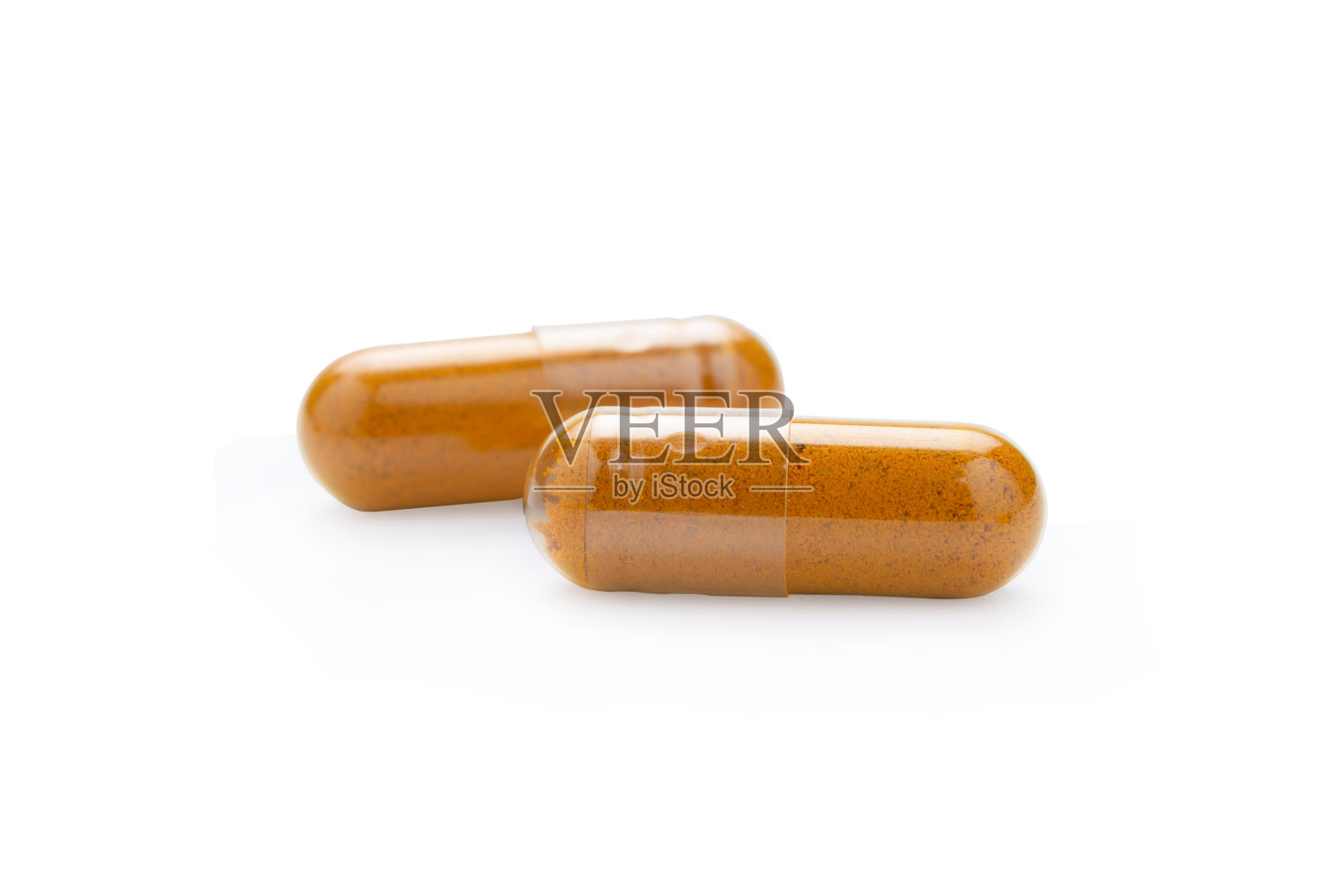 姜黄胶囊隔离在白色背景与剪辑路径照片摄影图片