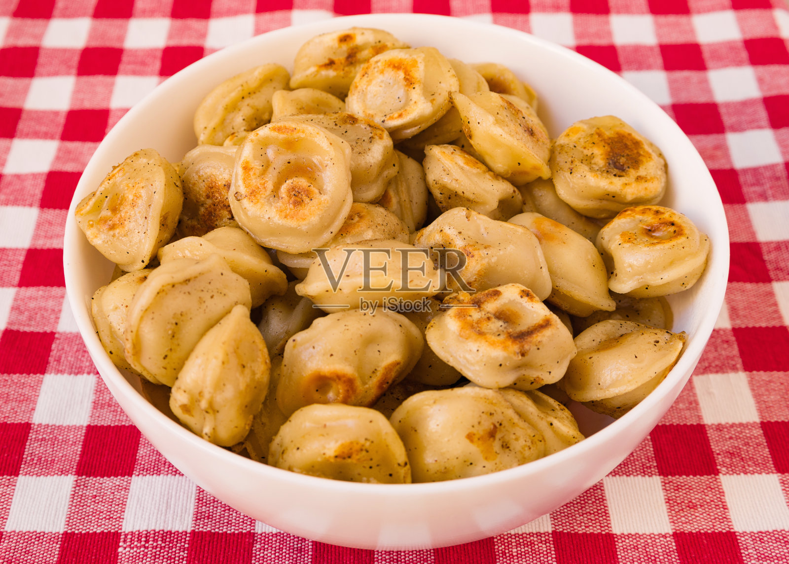 炸饺子。照片摄影图片