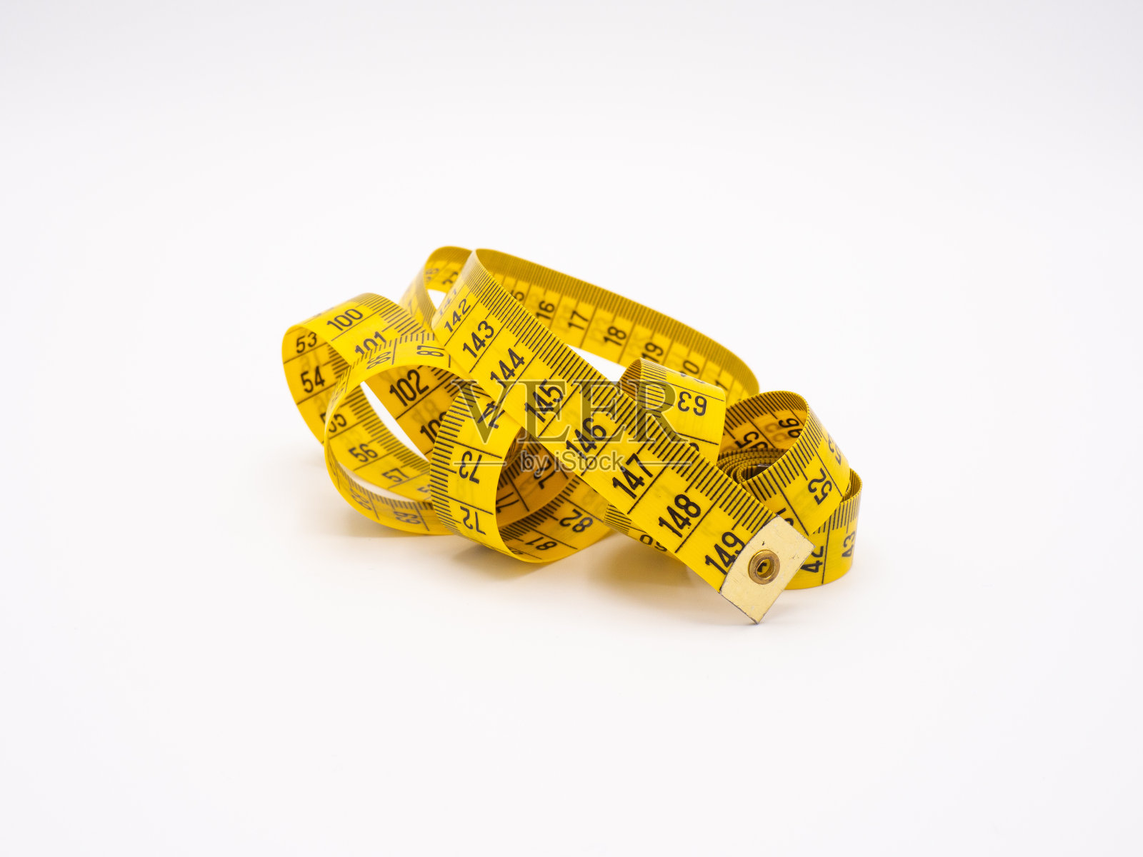 白色背景上的黄色米制卷尺照片摄影图片