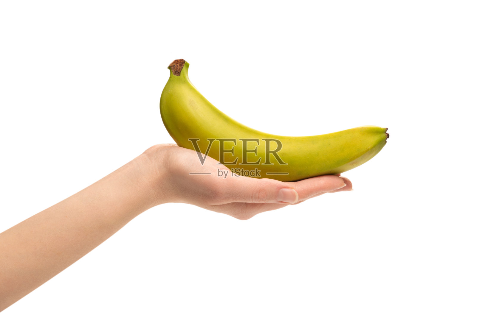 白色背景下，女人手里拿着一串香蕉。照片摄影图片