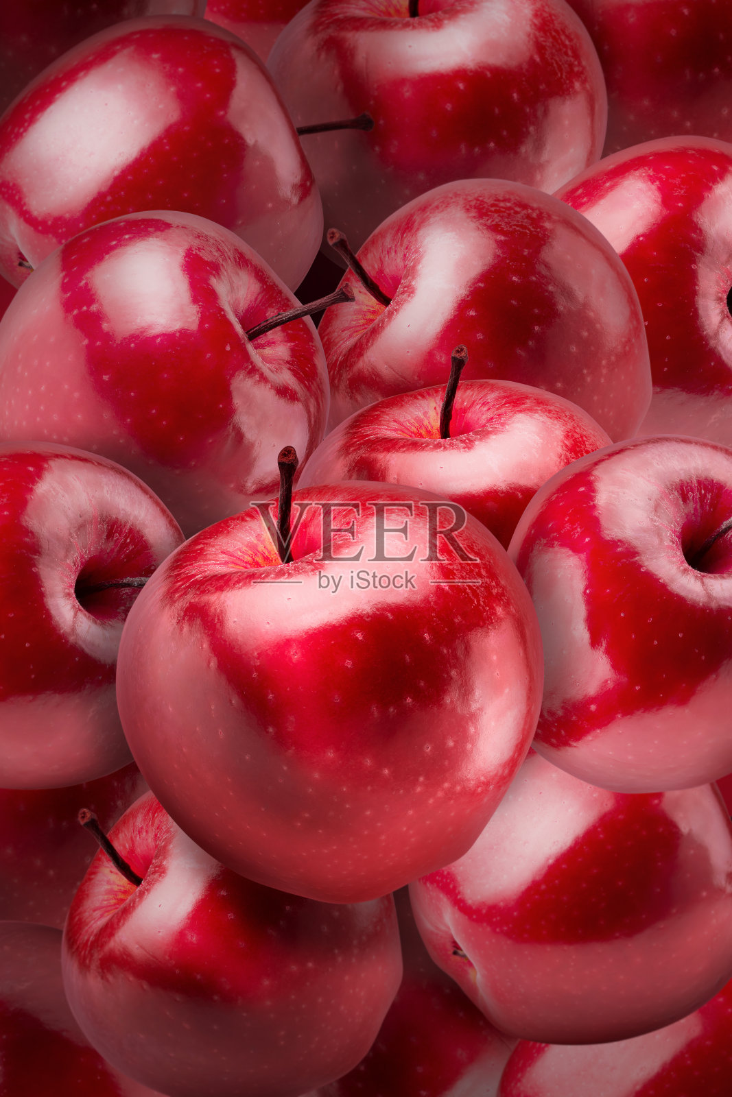 红苹果在红苹果背景上。照片摄影图片