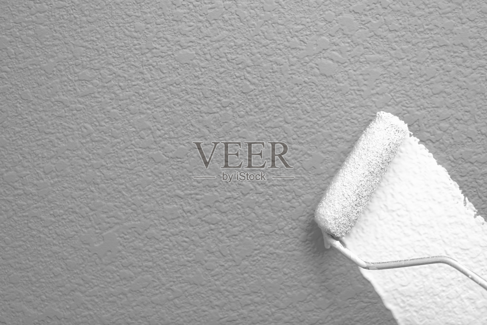 用漆辊刷墙照片摄影图片