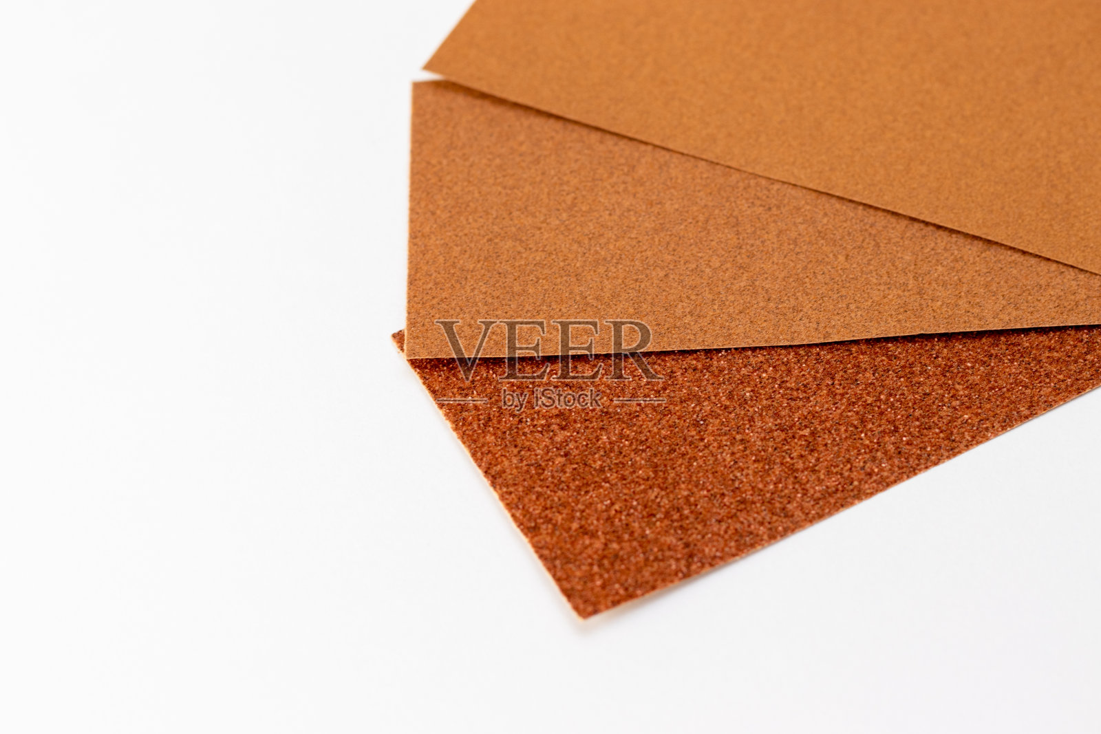 三张不同表面粗糙度的砂纸照片摄影图片