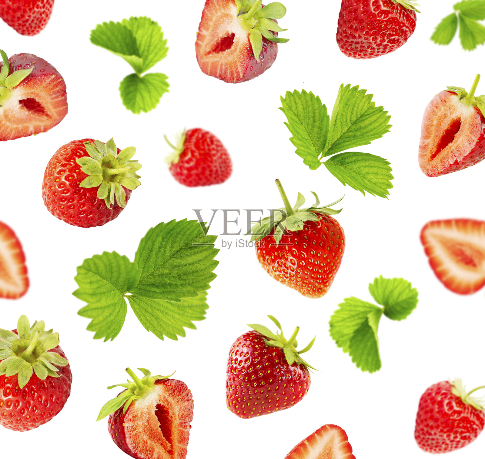 白色背景上的草莓和绿叶。照片摄影图片