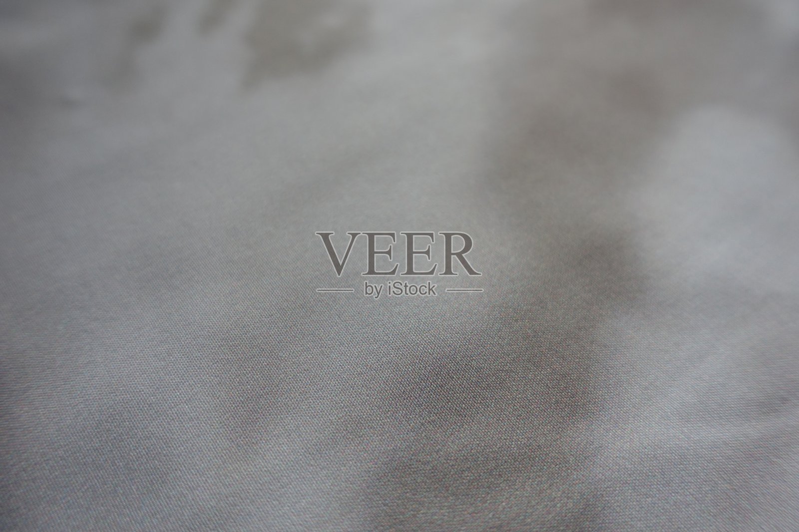 近距离观察粘胶和涤纶织物与扎染图案灰色阴影照片摄影图片