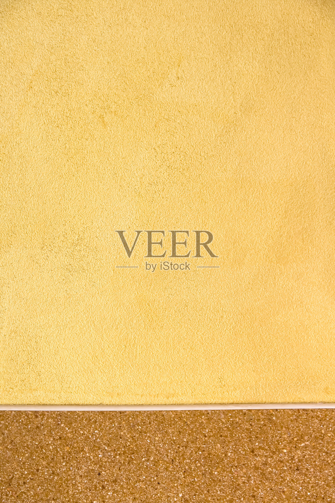 墙壁金色水泥与棕色石头图案的背景照片摄影图片