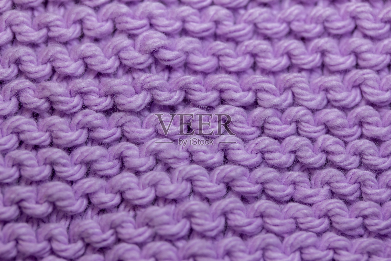 宏观抽象背景的手编纱织物纹理，颜色为淡紫色照片摄影图片