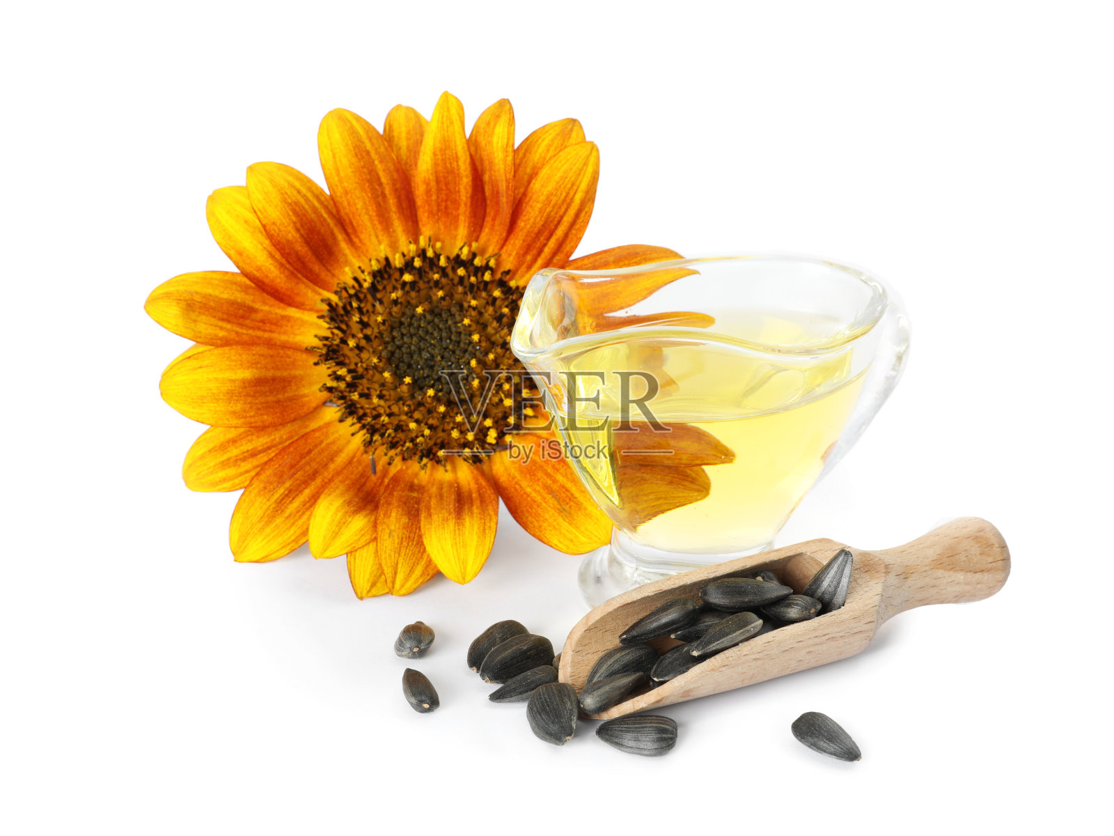葵花，一壶油和种子，白色背景照片摄影图片