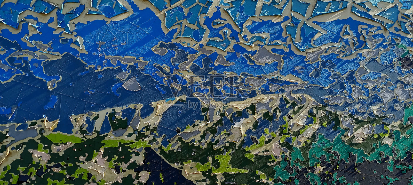 乙烯基胶膜破裂。纹理。抽象的背景。照片摄影图片