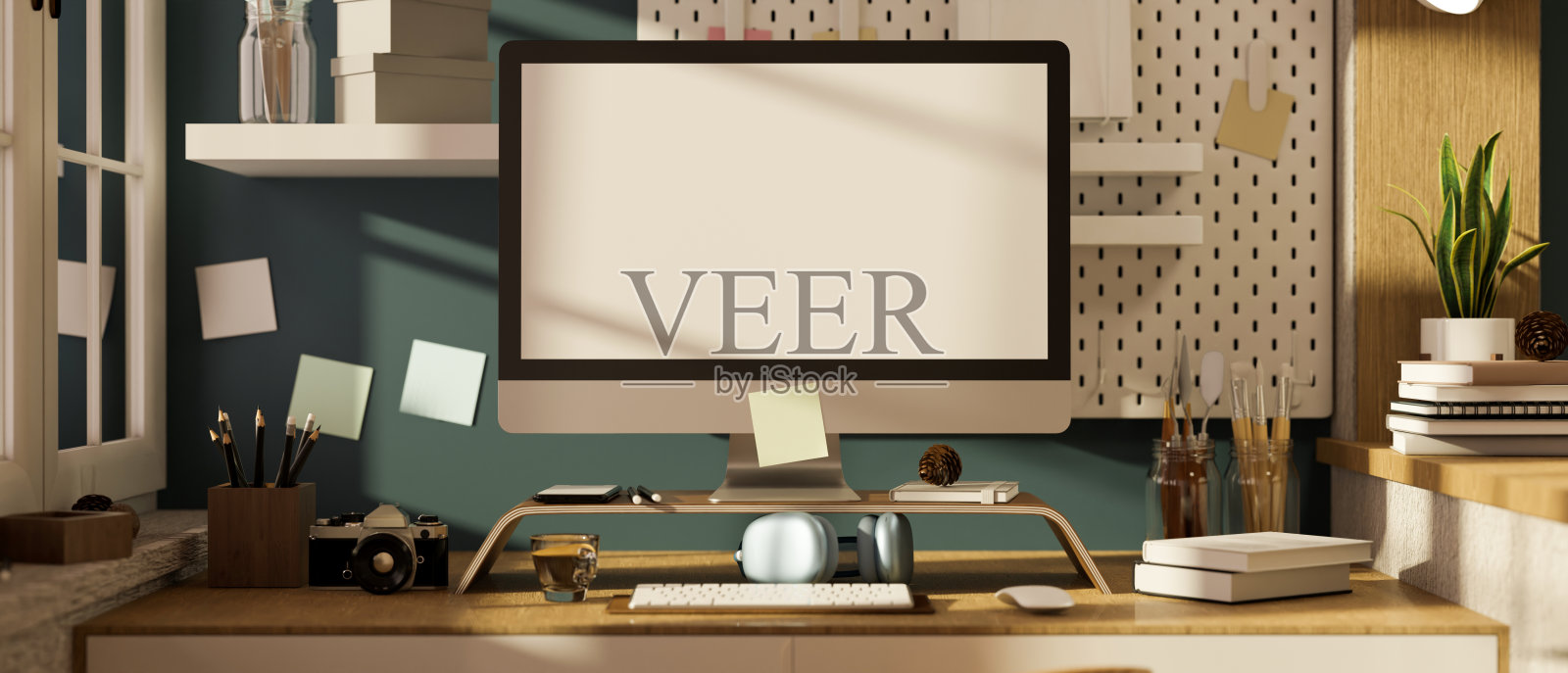 创意现代工作空间与pc桌面电脑在时尚的蓝色墙壁。照片摄影图片