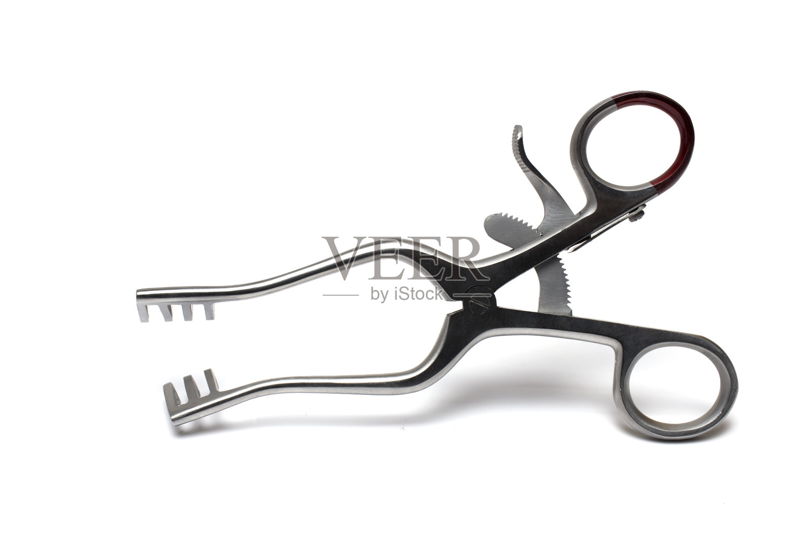 近距离牵开器扩张性伤口白色背景照片摄影图片