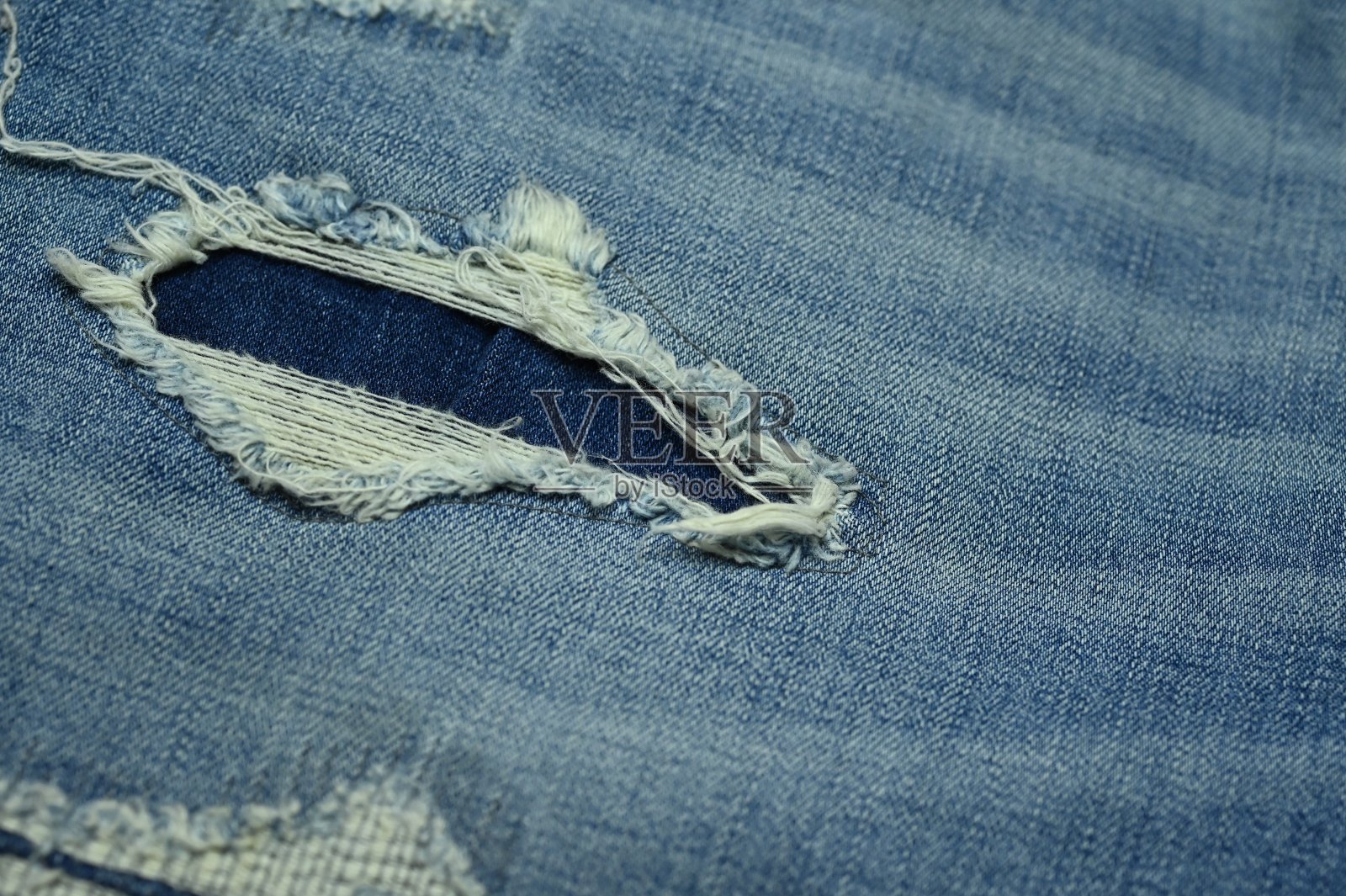 穿牛仔布，牛仔裤，裤子设计照片摄影图片