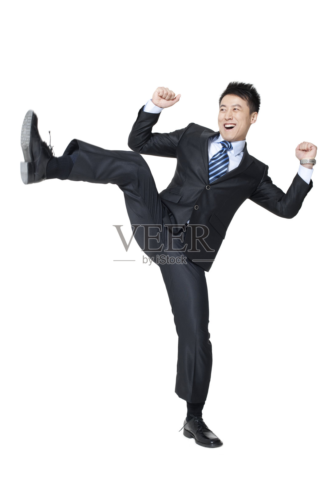 青年商务男士踢腿照片摄影图片