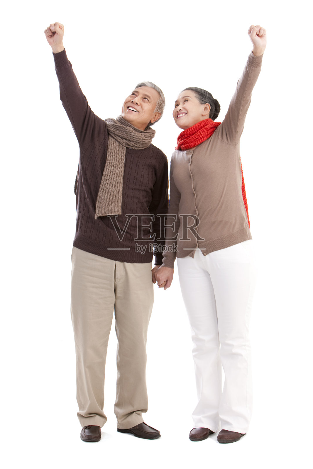 老年夫妇挥舞手臂照片摄影图片