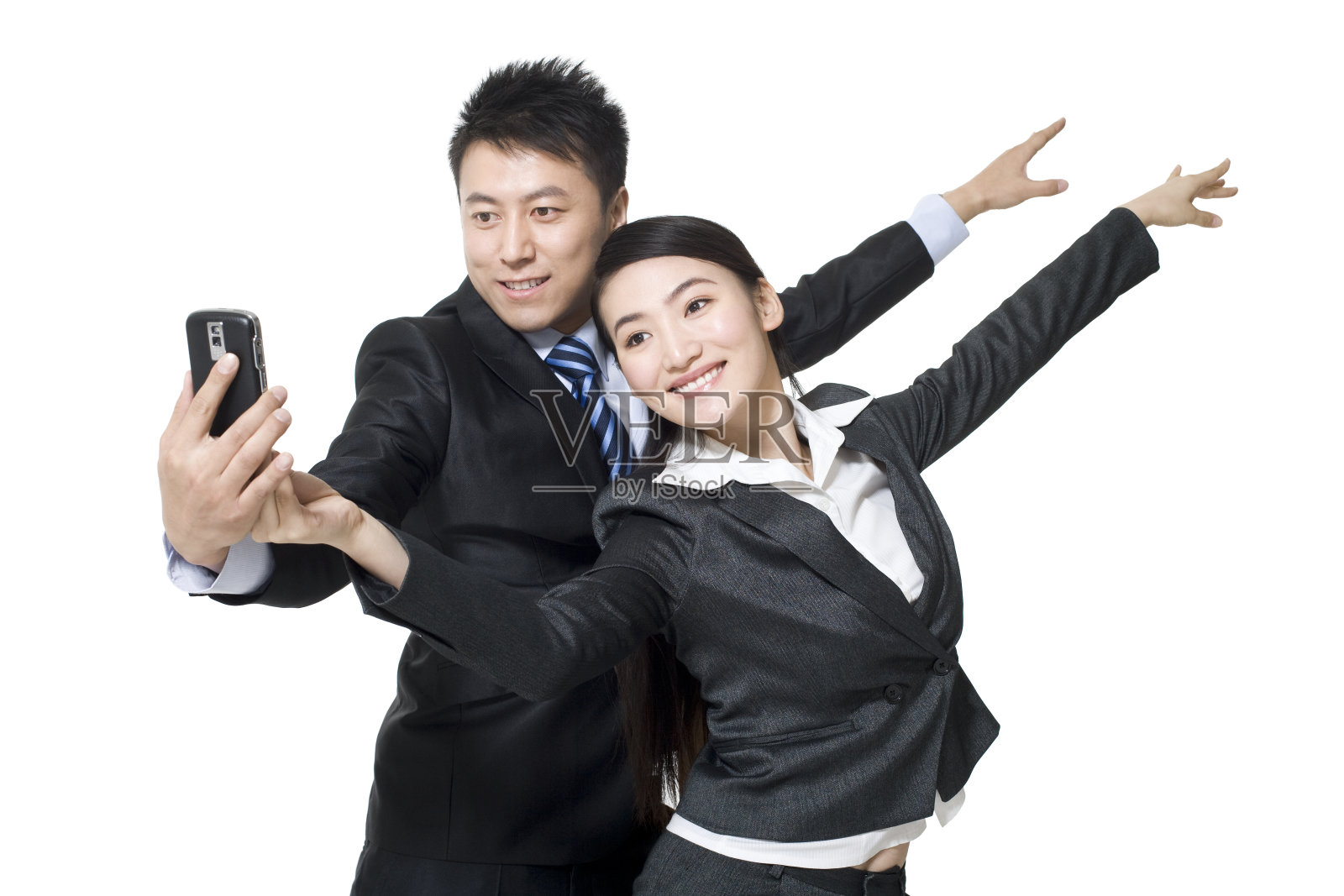 商务人士和手机照片摄影图片