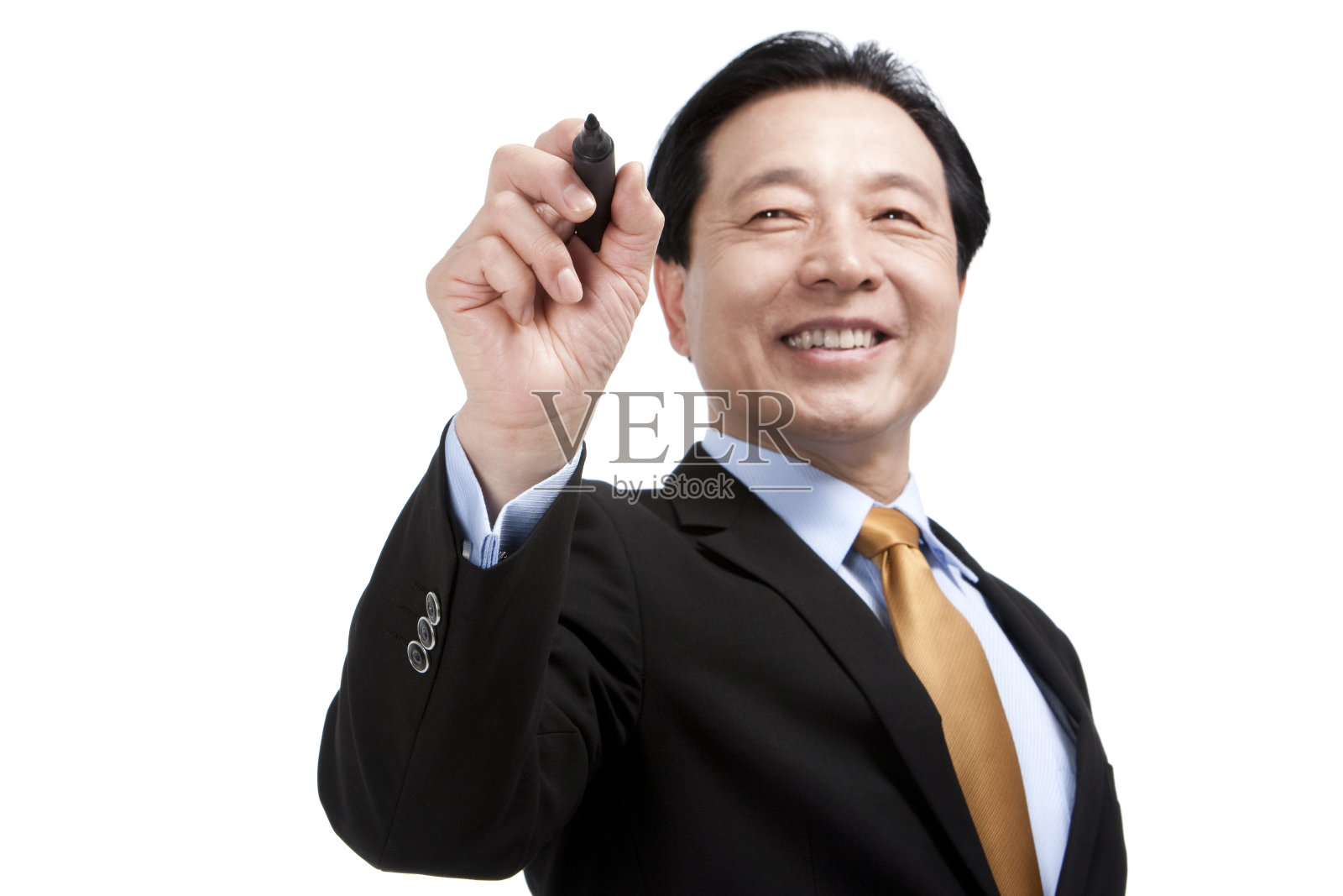 中年商务男士执笔书写照片摄影图片