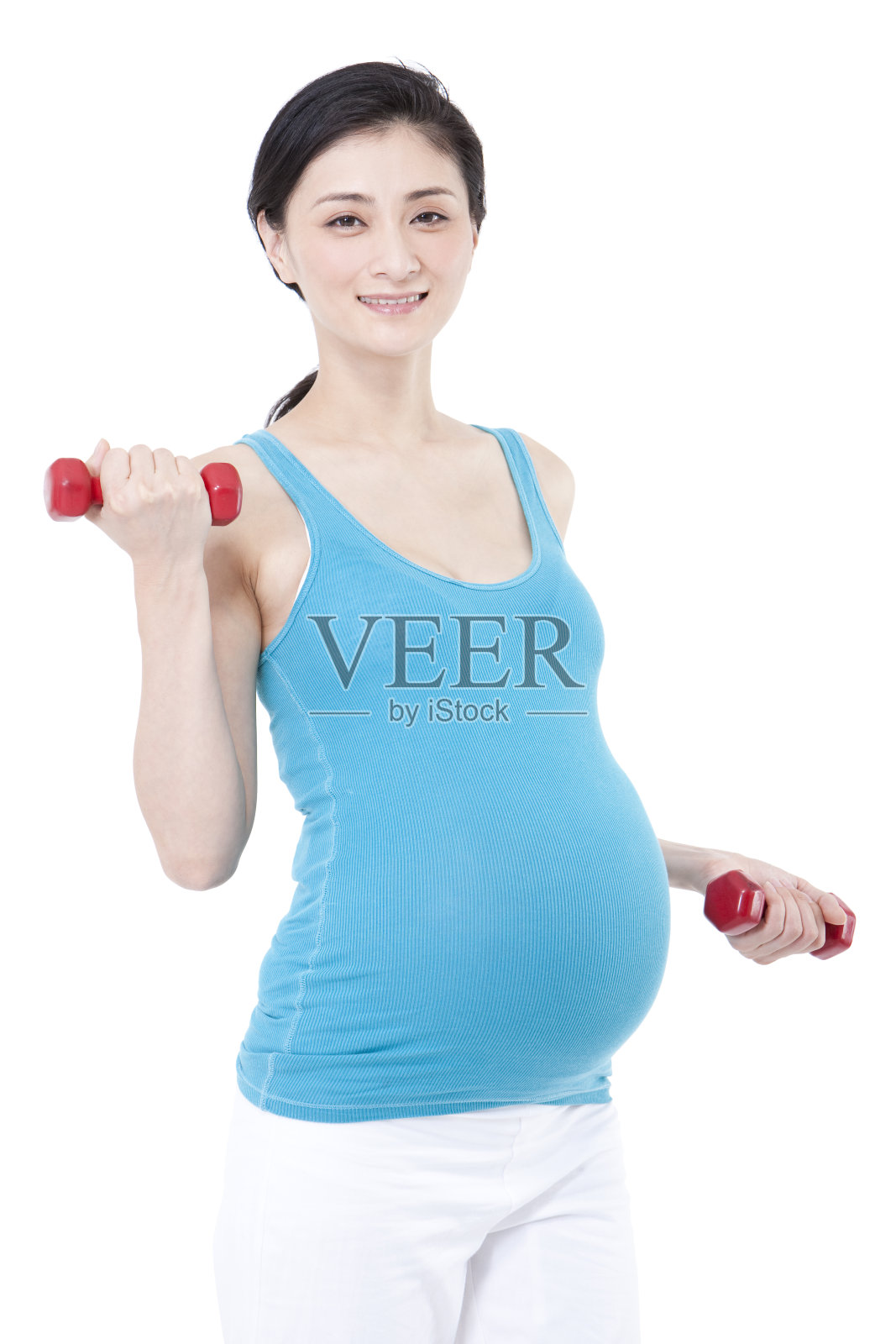 孕妇拿哑铃锻炼照片摄影图片