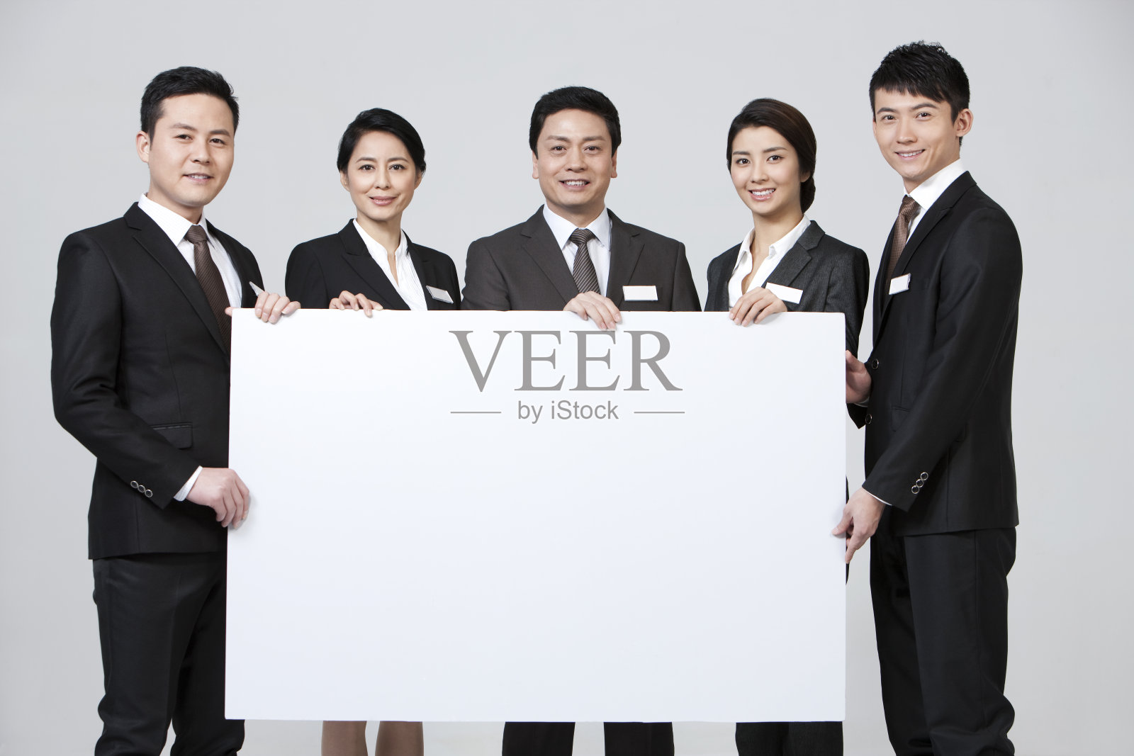 快乐商务人士与白板照片摄影图片