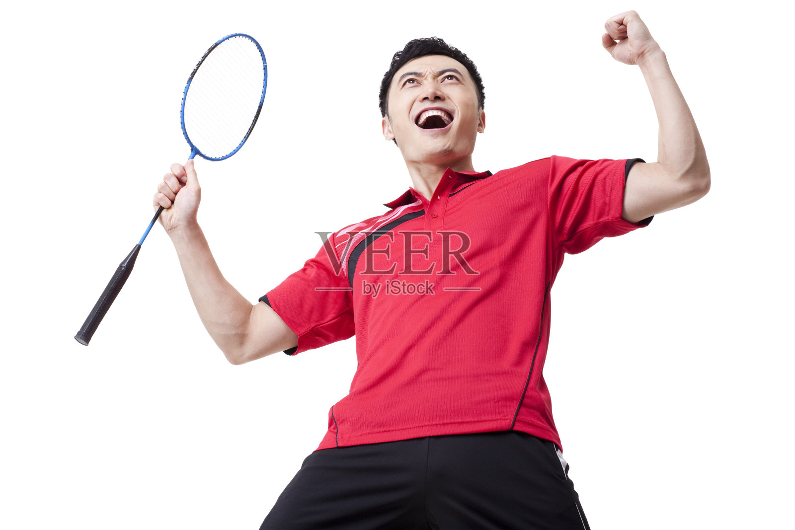 激动的羽毛球运动员振臂庆祝照片摄影图片