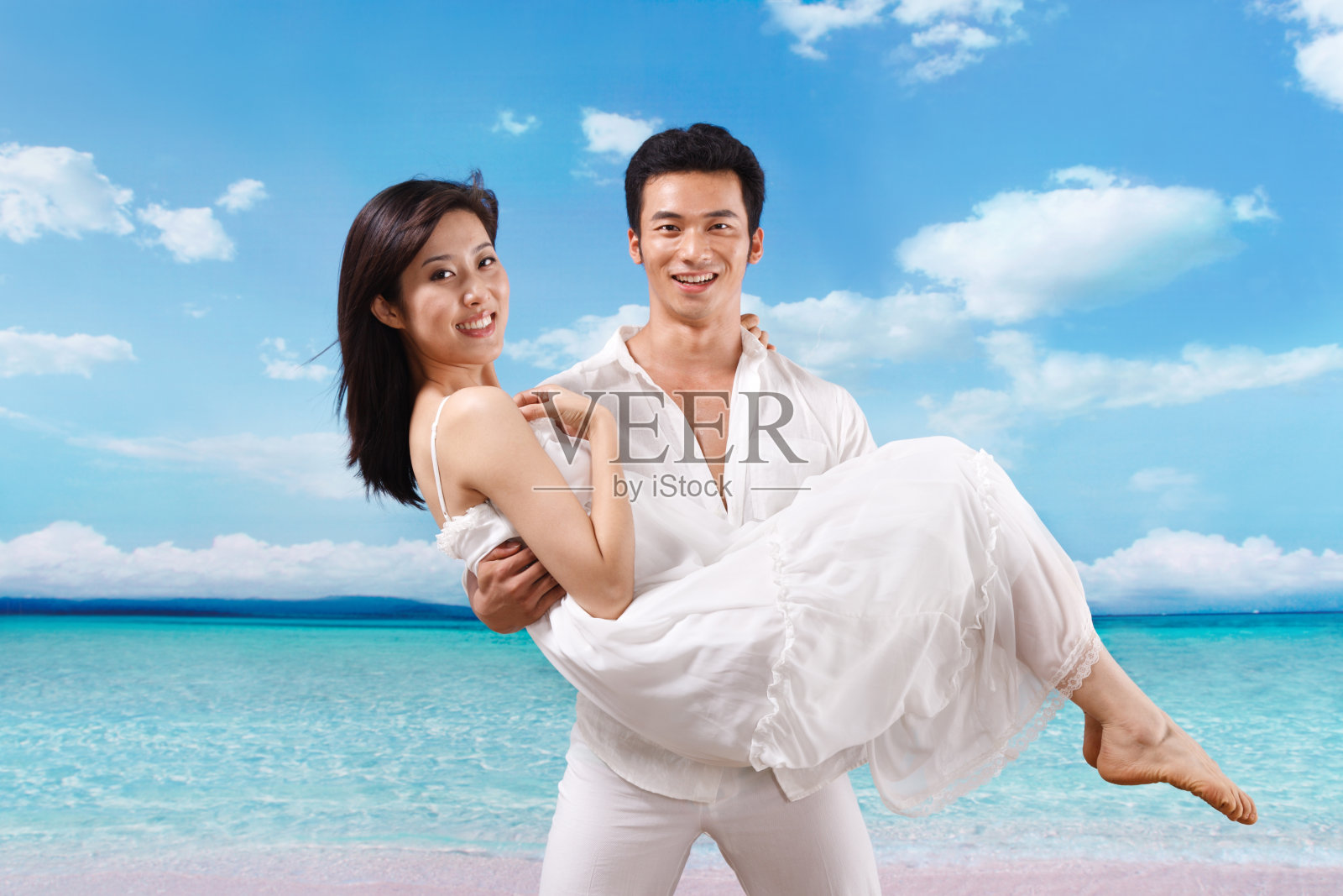 东方人海滩休闲生活照片摄影图片