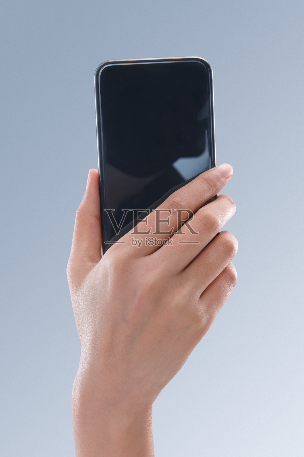 手拿手机照片摄影图片