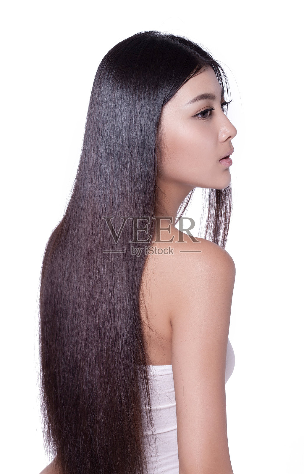 年轻女人亮丽丝缎般的头发照片摄影图片