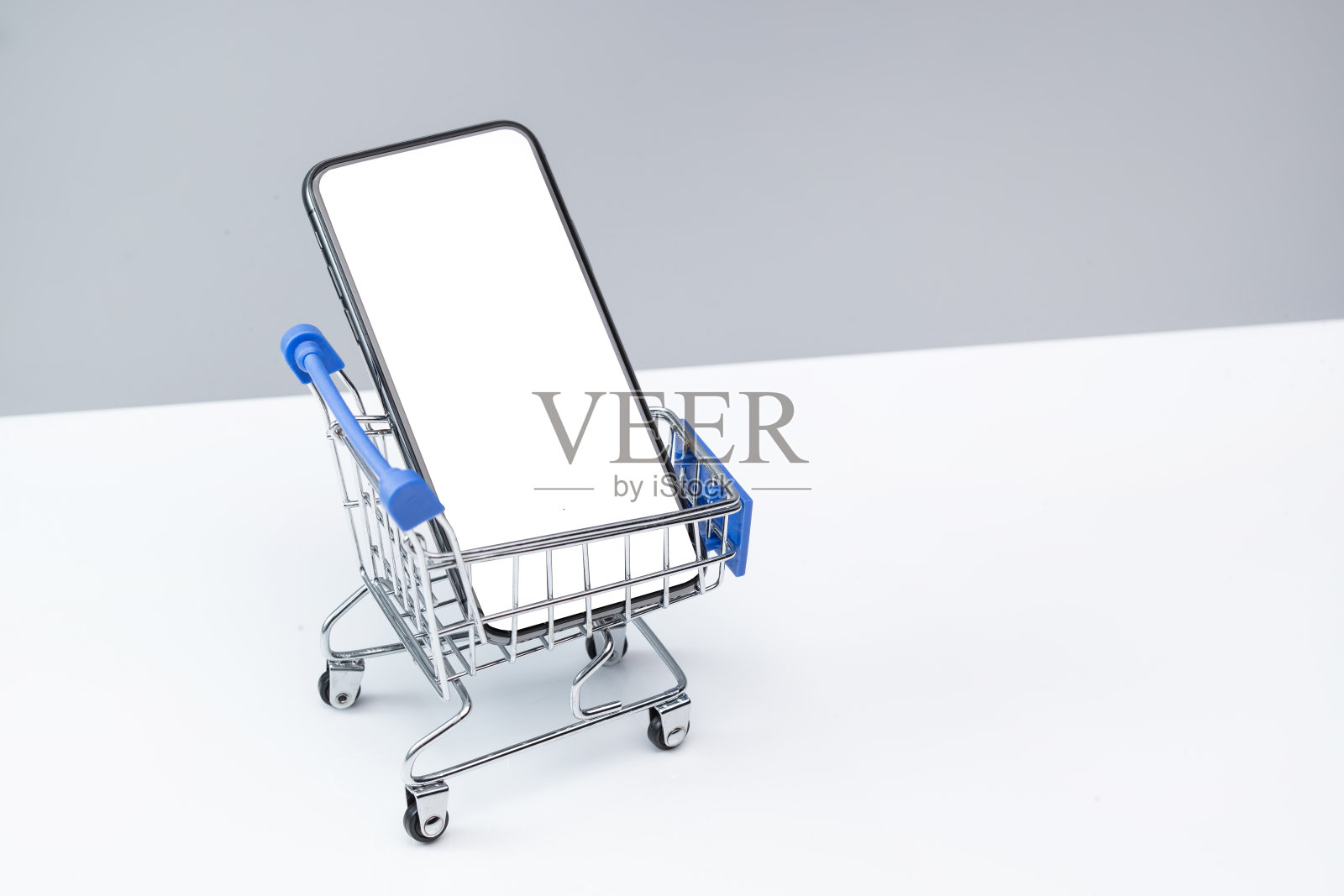 购物车和空白屏幕的手机照片摄影图片