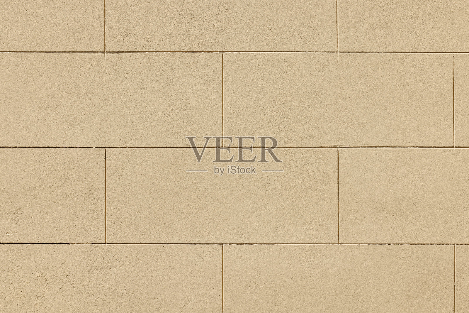 旧的新刷纹理米色混凝土砌块墙的一部分照片摄影图片