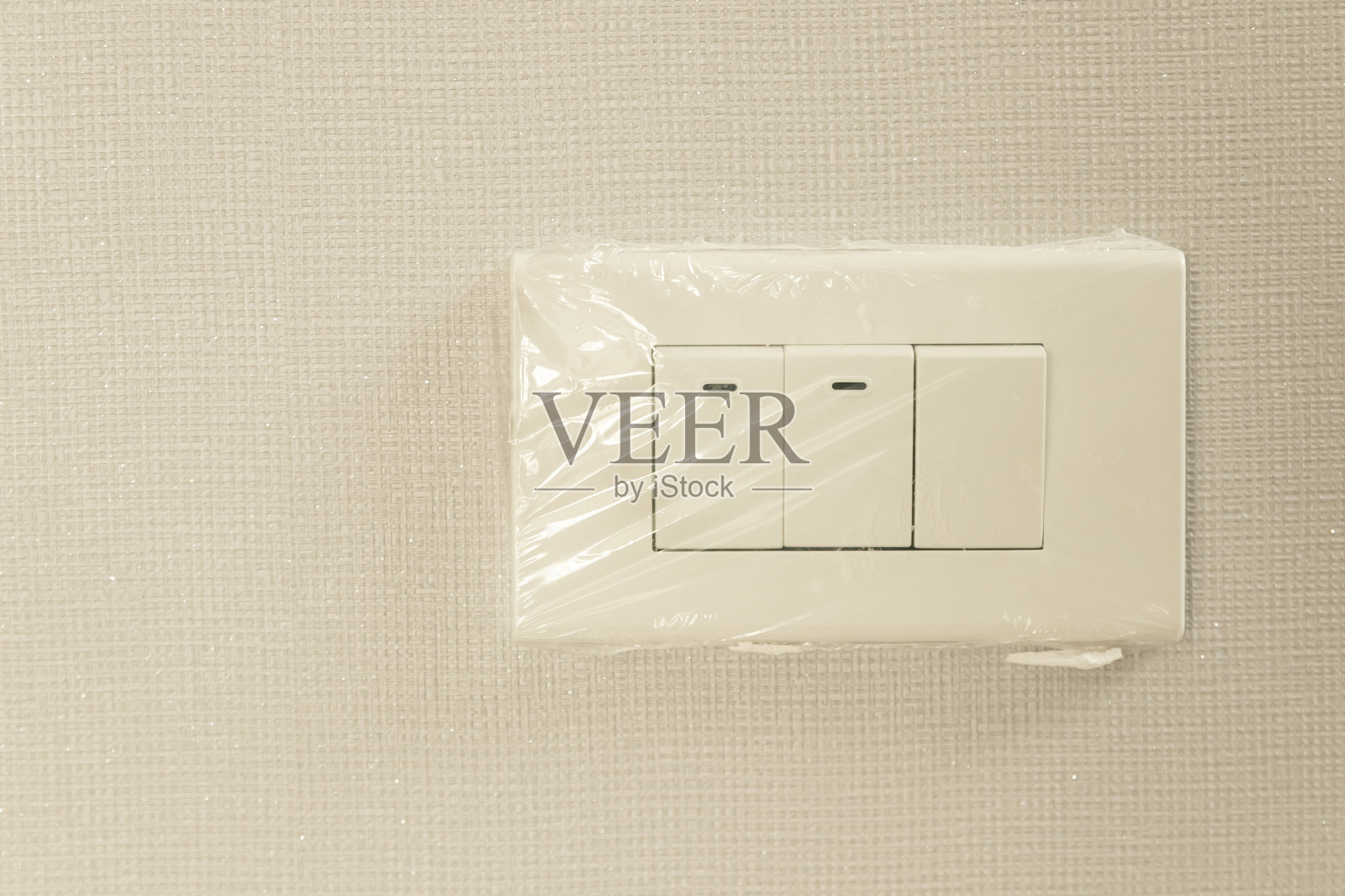 塑料包装的新电灯开关照片摄影图片