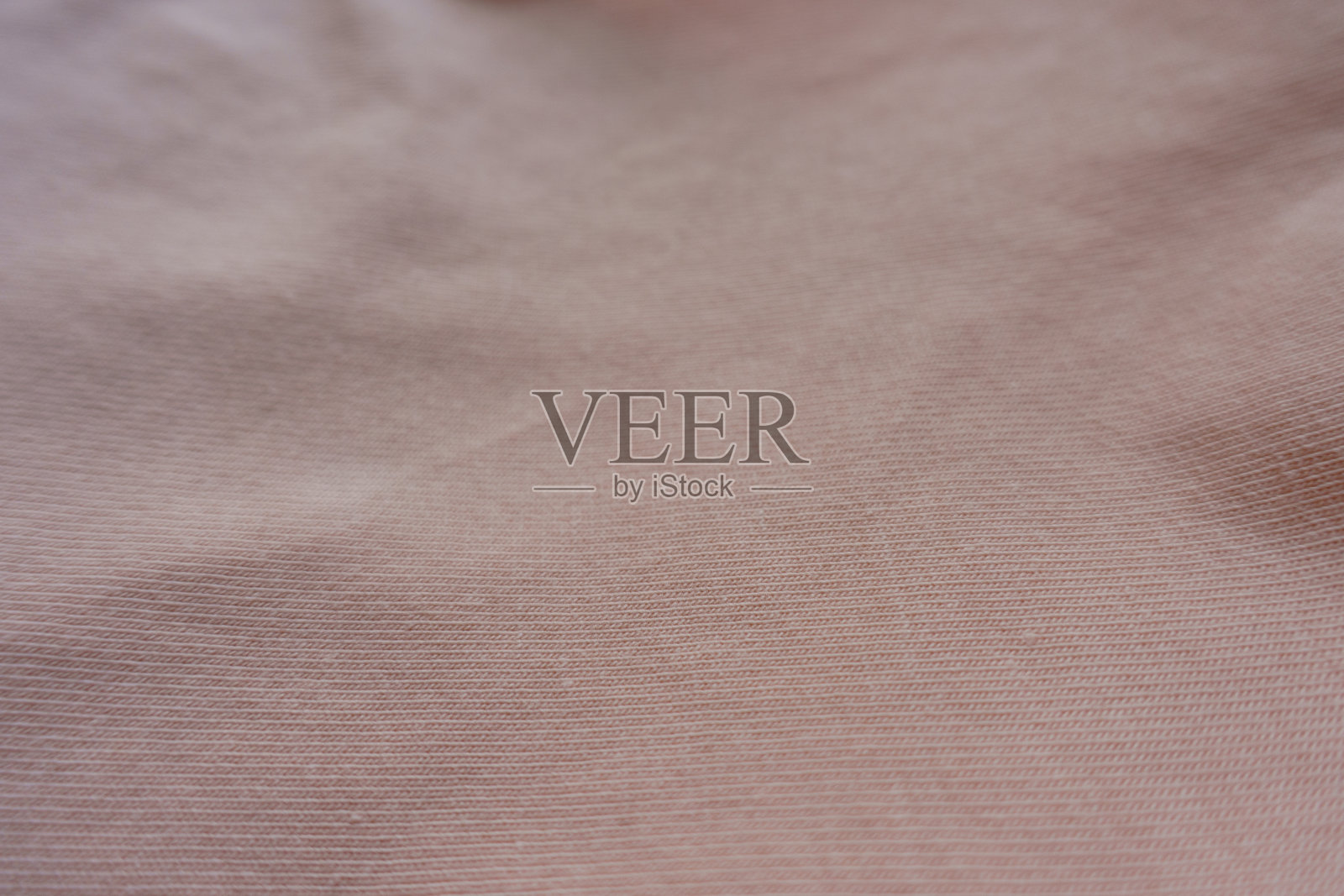 近距离拍摄的淡甜瓜粉红色棉织物针织物照片摄影图片