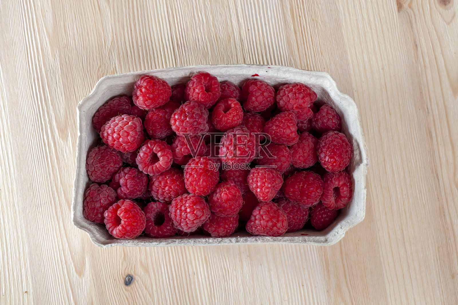 红色成熟的覆盆子包装照片摄影图片