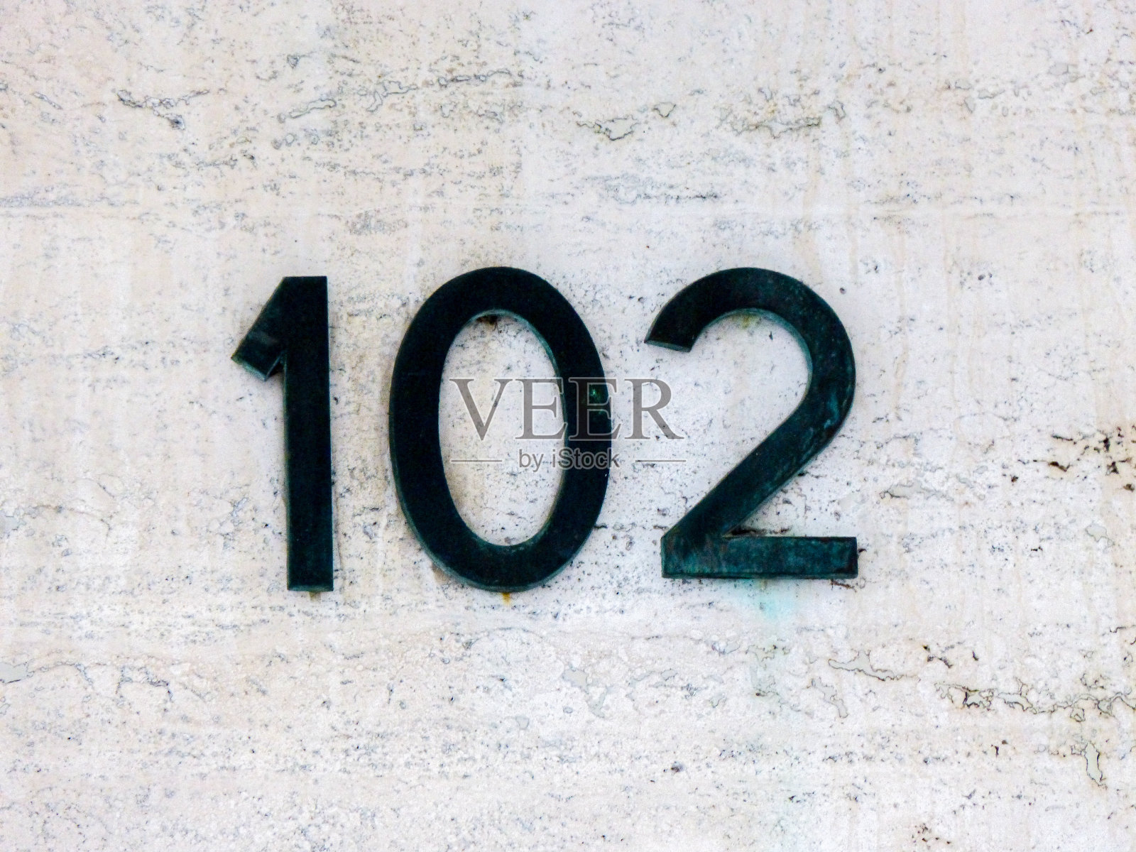 墙上的金属号码照片摄影图片