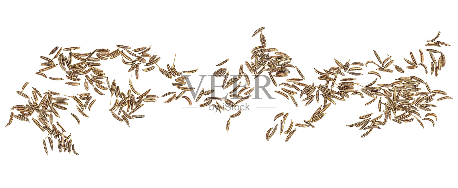 干孜然种子孤立在白色背景，俯视图。葛缕子种子。照片摄影图片