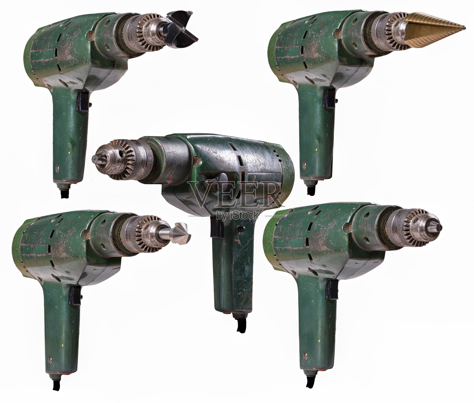 一台装有不同钻头的旧钻头。照片摄影图片