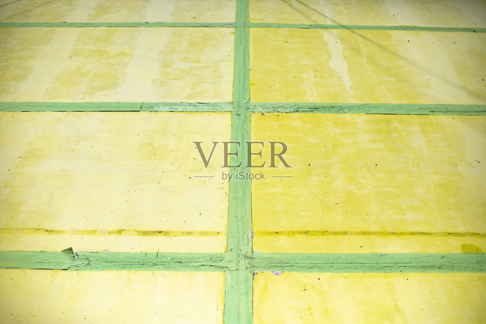 黄色的细胞和绿色的线。墙画。结构由矩形组成。照片摄影图片