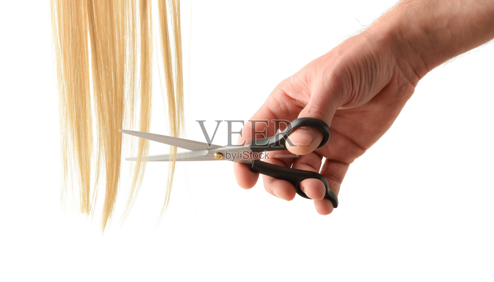 理发的概念与理发师用剪刀剪金发照片摄影图片