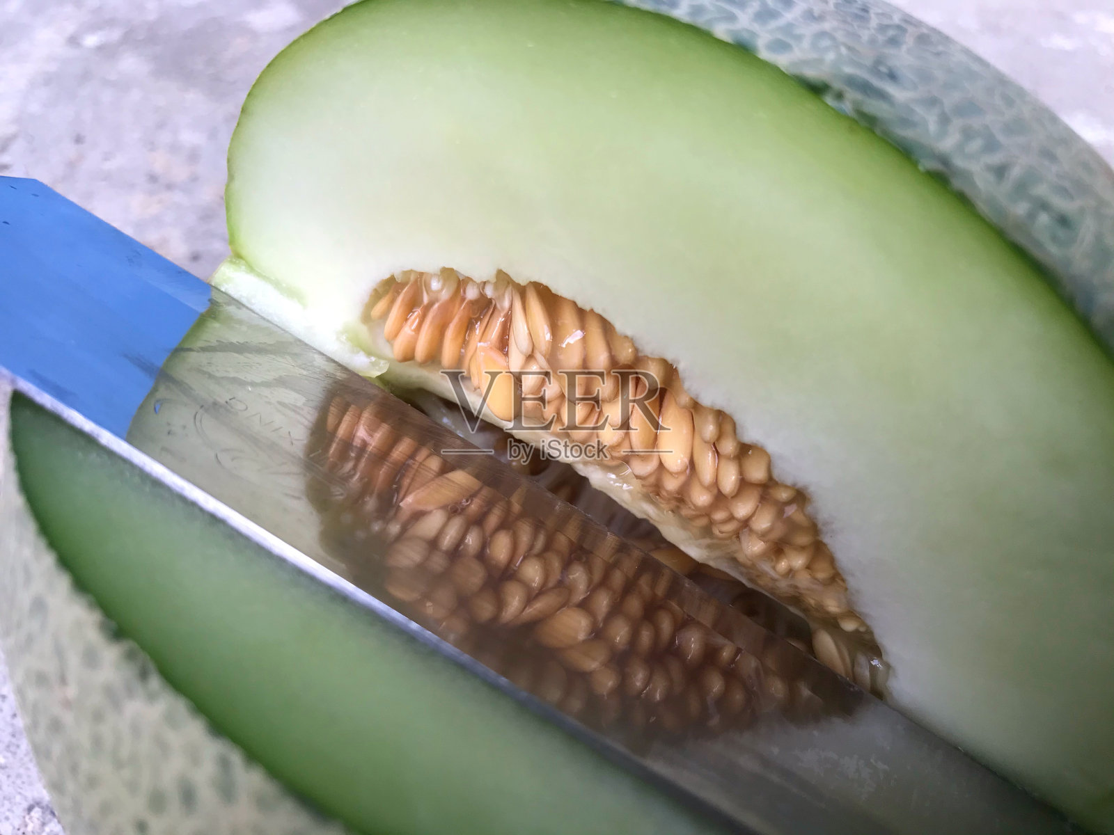 甜瓜菜刀照片摄影图片