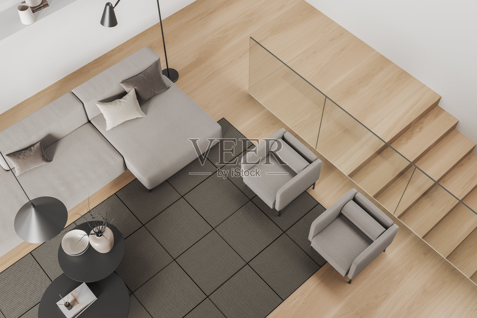 公寓内有沙发和座位、楼梯的起居室内部的顶视图照片摄影图片