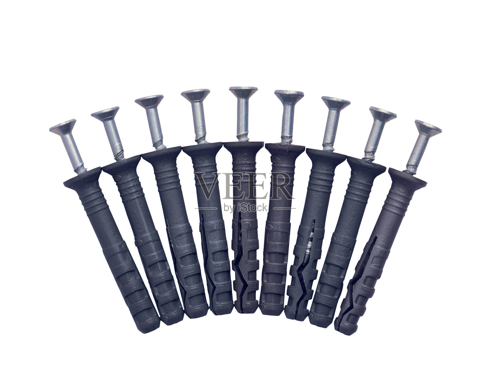 螺钉和销子隔离在一个白色背景的特写照片摄影图片